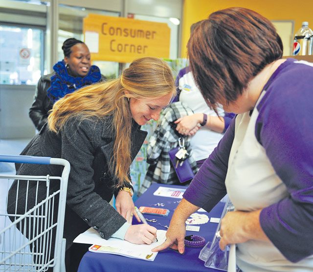A Ramstein Commissary customer volunteers for a domestic violence awareness freeze mob Oct. 13 on Ramstein. The Army Community Service Family Advocacy Program hosted the event and conducted an outreach table at the store to talk about domestic violence. October is domestic violence awareness month.