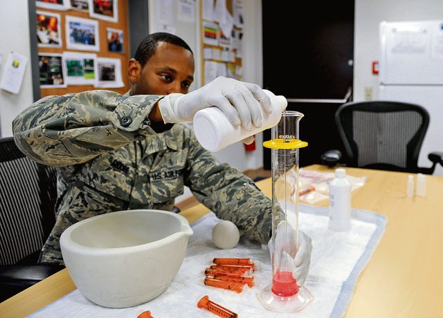 Staff Sgt. Joshua Moore, 86th Medical Support Squadron pharmacy technician, measures a prescription into a graduated cylinder Sept. 29 on Ramstein. Pharmacy technicians ensure that patients get the right prescriptions and education on proper use.