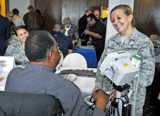 Medical personnel talk with a retiree during a Retiree Appreciation Week event Oct. 4 on Ramstein. The event provided a one-stop shop for the retirees to take care of questions they may have about medical or legal matters as well as receive financial assistance and flu shots.