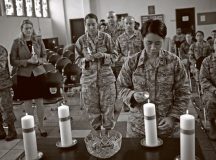 An Airman lights her candle in honor of a victim of interpersonal violence during a candlelight vigil Oct. 27 on Ramstein. According to the Center for Disease Control and Prevention, over the course of a year, more than 10 million U.S. citizens are victims of domestic violence, sexual abuse, child violence and bullying or suicide.