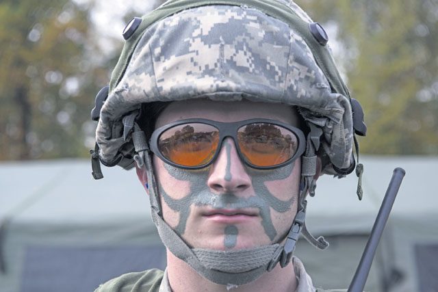 Senior Airman David DeSantis, 1st Combat Communications Squadron radio transmission systems technician, participates in exercise Healthy Thunder Nov. 4 on Ramstein. The Airmen put on face paint for the final battle of the field training exercise portion of Healthy Thunder, where opposing forces breached the base and Airmen defended it.