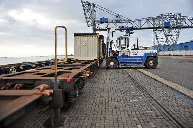 A driver at the port of Nordenham, Germany, places a container of ammunition onto waiting train cars. More than 600 containers of mixed Army and Air Force ammunition was shipped to Germany and moved to Miesau Army Depot for storage and distribution across Europe. This is the largest Army-run ammo shipment in Europe for more than 20 years.