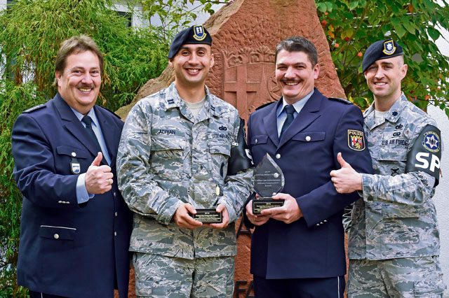 Polizeidirektor Franz-Josef Brandt (left); Capt. John-Paul Adrian, 569th U.S. Forces Police Squadron operations officer (middle left); Polizeihauptkommissar Simon Mai (middle right); and Lt. Col. Jason Sleger, 569 USFPS commander, pose for a photo Oct. 28 in Kaiserslautern. The two police departments received the 2016 Civilian Law Enforement — Military Cooperation Award from the International Association of Chiefs of Police.
