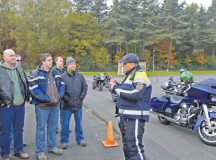 Wolfgang Hanker, chief of the Kaiserslautern Speed Control Unit, explains various motorcycle safety maneuvers to KMC motorcyclists during a safety rally Nov. 4 on Kapaun. The 86th Airlift Wing Safety office arranged for local police to come teach KMC RiderCoaches various safety maneuvers, who would then pass them along to other KMC motorcyclists.