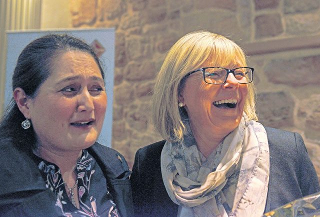 Mary Davis, U.S. Army Garrison Rheinland-Pfalz Public Affairs specialist (left), and Petra Lessoing, 86th Airlift Wing Public Affairs specialist, enjoy the 2016 German-American Day celebration Nov. 5 in Landstuhl. Lessoing was celebrated for her commitment to the German-American friendship, as she has worked on Ramstein for more than 32 years. 