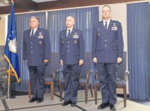 Col. Jonathan Sutherland, U.S. Air Forces in Europe and Air Forces Africa director of communications (left); Col. Curtis Juell, 86th Mission Support Group commander (middle); and Lt. Col. James Huso, 2nd Air Postal Squadron commander, stand at attention during the reading of the reassignment orders at the 2 AIRPS re-designation ceremony Nov. 9 on Ramstein. The ceremony signified the change in designation, assignment and organization of the 2 AIRPS to the USAFE-AFAFRICA AIRPS.