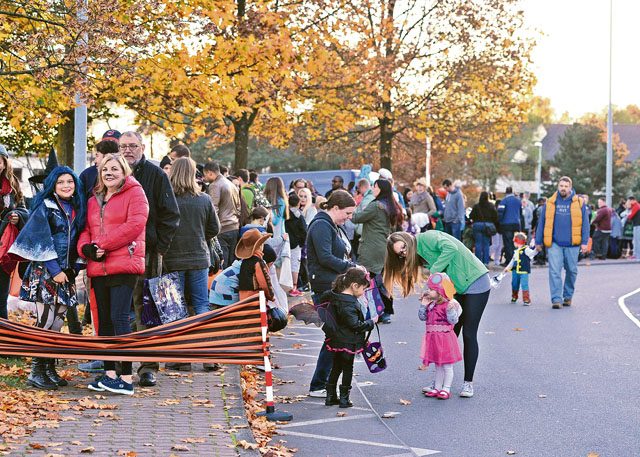 Photo by Senior Airman Jimmie D. Pike Members of the KMC line up in preparation for the Trunk or Treat event Oct. 31 on Ramstein. The event gave families the opportunity to trick or treat and experience the holiday in a safe environment.