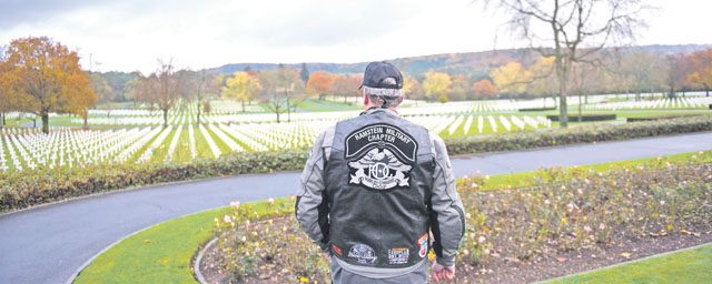 Bryan Osborne, 86th Airlift Wing Equal Opportunity director and member of the Ramstein military motorcycle club, gazes upon the rows of graves of deceased war veterans Nov. 11 at the Lorraine American Cemetery in St. Avold, France. Veterans Day is observed annually on Nov. 11 and commemorates military veterans who currently serve or have served the U.S. armed forces, including those who gave the ultimate sacrifice. According to the Department of Defense and Veterans Affairs, since World War I approximately 624,000 U.S. service members have been killed in action, battling in wars and conflicts. The Lorraine American Cemetery contains the buried remains of over 10,000 of them. It is the largest burial site of U.S. service members in Europe.