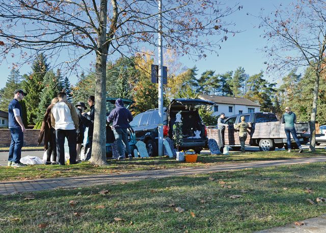 Photo by Senior Airman Jimmie D. Pike Volunteers from the KMC set up their trunks for the annual Trunk or Treat event Oct. 31 on Ramstein. Fifty-nine spots were rented out to be decorated for the event. 