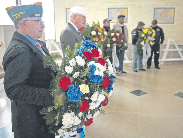 Representatives from several organizations visiting the Lorraine American Cemetery begin a wreath-laying ceremony to honor fallen war veterans Nov. 11 in St. Avold, France.