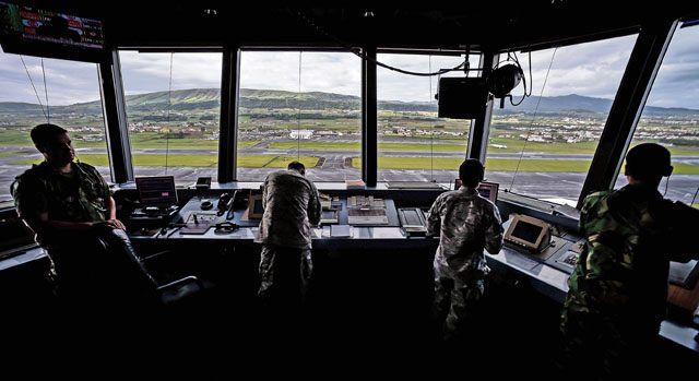 Air traffic controllers watch the flightline Oct. 5 at Lajes Field, Azores, Portugal. Six hours away from its parent wing at Ramstein, this geographically separated unit is home to more than 600 Airmen, including local nationals who serve there.