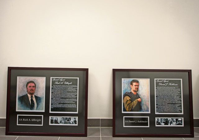 Two portraits of fallen Air Force Office of Special Investigations Airmen rest against a wall during the 25th Expeditionary Field Investigation Squadron’s fallen heroes dedication ceremony Nov. 10 on Ramstein. According to a recent Congressional Research Service report, more than 6,500 U.S. service members have lost their lives during post-9/11 conflicts in Iraq and Afghanistan.
