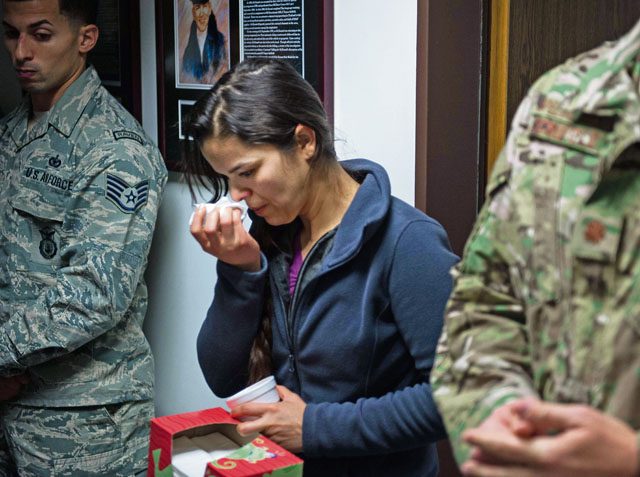 An event attendee listens as names of those who have lost their lives in the line of duty are read during the 25th Expeditionary Field Investigation Squadron’s fallen heroes dedication memorial Nov. 10 on Ramstein. 