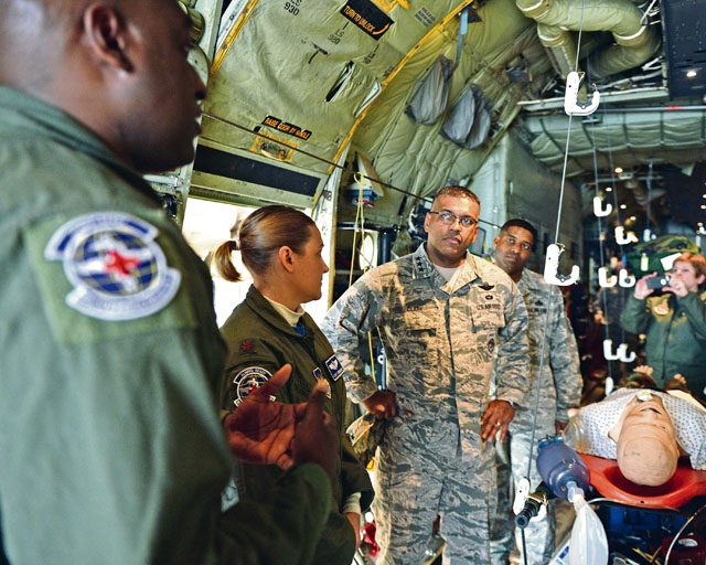 Lt. Gen. Richard M. Clark, 3rd Air Force and 17th Expeditionary Air Force commander, listens to a brief about aeromedical and critical care air transportation teams Dec. 2 on Ramstein. While touring Ramstein, Clark had the opportunity to see the back of a C-130J Super Hercules set up for an aeromedical flight.