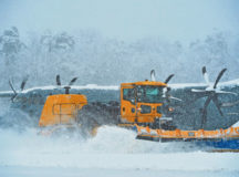 A snow plow removes snow on the flightline Jan. 10 on Ramstein. Snow removal operations commenced throughout Ramstein as continuous snow persisted throughout the majority of the day. Other snow removal operations included de-icing aircraft and applying salt to roads and walkways.