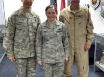 Courtesy photo
Senior Airman Paige Hoag poses with Chief Master Sgt. Todd Petzel, 18th Air Force command chief, and Lt. Gen. Samuel D. Cox, 18th Air Force commander, after a coining ceremony Dec. 19 on Ramstein.