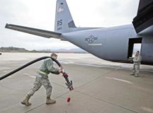 Airman 1st Class Austin Bashaw, 86th Logistics Readiness Squadron fuels distribution operator, carries a hose from the fuel truck to a parked C-130J Super Hercules Dec. 12 on Ramstein. Fuels specialists are also responsible for operating the vehicles, equipment and storage facilities that are essential to the refueling operation, while also ensuring the compliance of all safety regulations involved with handling these volatile liquids.