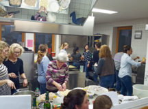 Photo by John Constance
American and German women attend a German cooking class in Kottweiler-Schwanden's community hall. In five months, participants learned to cook German meals and made new friends.
