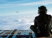 Photo by Senior Airman Lane T. Plummer
Airman 1st Class Quinn Harris, 37th Airlift Squadron loadmaster, peers over the skies at another C-130J Super Hercules flying over a blanket of clouds Feb. 10. During the Korean War, the squadron flew airborne assaults at Sukchon, North Korea, and Munsan-ni, South Korea, and aerial transportation between Japan and Korea.