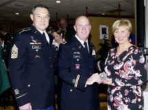 Photo courtesy Duelmener Zeitung newspaper
Col. Rodney Honeycutt, 405th Army Field Support Brigade commander (center), presents Lisa Stremlau, mayor of Duelmen, Germany, with an official 405th AFSB commander’s coin during the town’s New Year’s celebration Jan. 15 at the assembly hall of the school center in Duelmen. The mayor invited Col. Honeycutt and Command Sgt. Maj. Morgan, 405th AFSB command sergeant major (left), and other partners to the event in order for the 405th leadership team to meet and visit with local leaders and citizens. The 405th AFSB, other military partners and local personnel will be holding a ribbon-cutting ceremony in May to celebrate the opening of the APS2-Duelmen, the second Army Prepositioned Stock location to be opened in Europe.