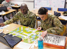 Sgt. Maj. Bobby White, left and Sgt. Justine Westbrook, both from the 361st Civil Affairs Brigade, play a Russian version of Scrabble for practice during their four-day class to learn Russian March 15 on Daenner Kaserne. Seven Army Reserve Soldiers — from the 361st Civil Affairs Battalion headquarters in Kaiserslautern and its down trace unit, the 457th Civil Affairs Battalion in Grafenwoehr — attended the class, taught by Defense Language Institute.