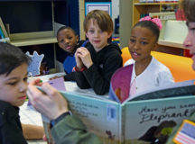 Photo by Staff Sgt. Nesha Humes
Ramstein Elementary School students listen to Capt. Charity Bolling, 86th Aerospace Medicine Squadron flight commander, read a book during the Dr. Seuss Reading Cafe March 3 on Ramstein.