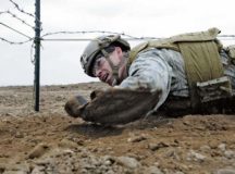 1st Lt. Jeffrey Davis, 435th Security Forces Squadron assistant operations officer, low-crawls while participating in the 435 CRG Olympics May 5 on Ramstein. The 435th Air Mobility Squadron, 435th Construction and Training Squadron, 435th Security Forces Squadron, and Detachment 1 each planned a competitive event to challenge the teams to not only compete, but to share with one another what each squadron in the 435 CRG does every day.