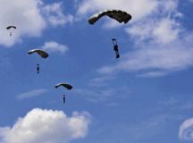 Five Greek paratroopers descend to the ground after conducting a military free-fall jump out of a C-130J Super Hercules during Exercise Stolen Cerberus IV April 22 above Megara, Greece. The paratroopers descended 10,000 feet to reach the ground. Combined exercises such as these enhance the interoperability capabilities and skills among allied and partner armed forces.