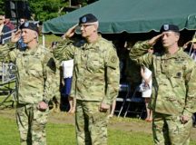 Landstuhl Regional Medical Center outgoing Commander Col. James Laterza, Regional Health Command Europe Commanding General Brig. Gen. Dennis P. LeMaster and incoming LRMC Commander Col. Timothy Hudson salute to honor the German and American national anthems during the LRMC Change of Command Ceremony June 13 in Landstuhl. — Photos by Liz Paque