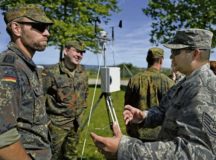 Tech. Sgt. Christopher Hardy, 7th Weather Squadron noncommissioned officer in charge of regional weather maintenance, right, speaks with German NATO partners during a weather-related exercise June 12 in Wiesbaden. The 7 WS uses Exercise Cadre Focus to enhance its capability to provide weather support to U.S. Army operations in Europe.