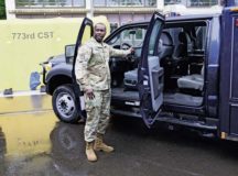Master Sgt. Desmond Burgess, 773rd Civil Support Team communication chief, explains the capabilities of the unit’s new Unified Command Suite vehicle during a ribbon-cutting ceremony Aug. 10 on Panzer Kaserne.