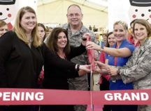 Brig. Gen. Richard G.  Moore Jr., 86th Airlift Wing commander, center, cuts a  ribbon for the Ramstein Bazaar’s 53rd Grand Opening with Mary Waibel (from left) and Kim D’Ippolito, Ramstein Bazaar co chairs, Kara Montano, 86th Force Support Squadron special events coordinator and Lt. Col. Renee Thoutte, 86th FSS commander Sept. 13 on Ramstein. More than 130 vendors are projected to sell merchandise at the shopping event today through Sunday on the Ramstein flightline. 
 — Photo by Staff Sgt. Nesha Humes Stanton