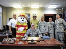 Brig. Gen. Richard G. Moore, Jr., 86th Airlift Wing commander, and leadership from the 86th Civil Engineer Group and 86th Civil Engineer Squadron gather for the signing of the Kaiserslautern Military Community’s Fire Prevention Proclamation Sept. 28 at Ramstein. This year’s Fire Prevention Week theme, “Every second counts, plan two ways out!”, is to encourage people to have more than one safe exit during a fire incident. — Photo by Airman 1st Class Savannah L. Waters