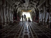 Airmen assigned to the 86th Aircraft Maintenance Squadron and 37th Airlift Squadron sit in a C-130J Super Hercules during taxi to a parking spot Oct. 13 on Ramstein Air Base. Crew chiefs work hand in hand with pilots to ensure all issues that arise with the aircraft are resolved.