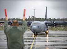 Brig. Gen. Richard G. Moore Jr., 86th Airlift Wing commander, marshals in the newest C-130J Super Hercules in the fleet, piloted by Col. Joseph H. Wenckus, 86th AW vice commander, Dec. 4. The C-130J is known as the workhorse of the military ready for any mission , anytime, anywhere. — Photo by Senior Airman Devin Boyer