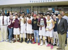 Led by head coach DeWayne Piggé (far left) and assistant Darrell Winfrey (far right) the Buccaneers earned the school’s first boys’ basketball title since 2009.