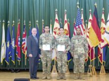 (Left) Installation Management Command-Europe Director Michael Formica and (far right) IMCOM-Europe Command Sgt. Maj. Ulysses D. Rayford congratulate the NCO of the Year Staff Sgt. Jeremy Lucena from U.S. Army Garrison Bavaria, and IMCOM-Europe Soldier of the Year Spc. Nicholas N. Kernen from USAG Ansbach, at the 2018 IMCOM-Europe Best Warrior Competition ceremony, March 14.  Photo by Otis Toussaint