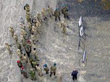 Distinguished visitors from multiple nations gather for a briefing about the day’s operations during exercise Dynamic Front 18, at U.S. Army Garrison Bavaria March 7 in Grafenwoehr. Dynamic Front 18 is a U.S.-sponsored multinational exercise that involved participation from 26 NATO, allied, and partner nations.