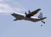 A U.S. Air Force C-130J Super Hercules drops an equipment bundle during exercise Stolen Cerberus V May 15 over Megara Drop Zone, Greece. Hellenic riggers worked with U.S. Air Force Joint Airdrop Inspectors to ensure the bundle was rigged properly.