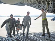 86th Medical Squadron Critical Care Air Transport Team Airmen move a simulated burn victim onto a C-5 Galaxy aircraft during a burn victim evacuation exercise May 9 on Ramstein Air Base. The 86th MS is a high-paced squadron that trains constantly and is ready to respond any moment, day or night, to save lives across Europe and Africa.