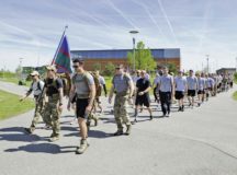 Tactical Air Control Party Airmen and their families from across Europe march the final mile as a group during the 7th Annual TACP 24-hour Run Challenge at U.S. Army Garrison Bavaria, Germany, April 27, 2018. The 24-hour Run Challenge is a worldwide event consisting of TACP teams participating globally at the same time. Of the 75 participants, more than 1,050 miles were walked during the memorial run at USAG Bavaria. Photo by Senior Airman Savannah L. Waters