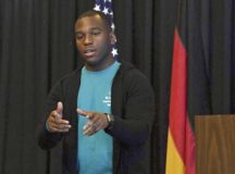 Staff Sgt. George Linen, 786th Civil Engineer Squadron electrical systems supervisor and sexual assault survivor, performs an original poem called “Speak” during the Sexual Assault Prevention and Response Leadership Breakfast at Ramstein Air Base, April 12. Linen aimed to inspire other survivors to stay strong while sharing the impact sexual assault violence has on its survivors.