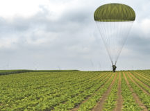 U.S. Army Staff Sgt. Triberious Calhoun lands in a field as part of International Jump Week 2018 May 23 near Ramstein Air Base. Calhoun said the weeklong event was a positive experience that brought participating countries together to make things in airborne operation more efficient.