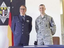 Ingolf Hubert, left, Polizei head of department of education and training, and U.S. Air Force Lt. Col. Jason Sleger, 569th U.S. Forces Police Squadron commander, pose for a photo after signing a memorandum of agreement June 6 on Kapaun Air Station. The 569th USFPS and Polizei partnership demonstrates a model of American and German partnership.