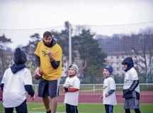 Alejandro Villanueva, Pittsburgh Steelers offensive lineman, coaches one of his camp attendees on defensive drills during his football camp at Kaiserslautern High School on Vogelweh Military Complex, April 14. After leaving the U.S. Army, Villanueva worked and signed with the Steelers to play in the NFL.