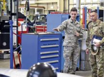 U.S. Air Force Staff Sgt. Zachari Winters, 86th Vehicle Readiness Squadron vehicle maintenance and customer service representative, shows U.S. Air Force Col. Lyle Drew, 78th Air Base Wing commander, a new innovation in their auto shop on Ramstein Air Base, Jan. 15. Winters explained how the 86th VRS streamlined their vehicle repair process.