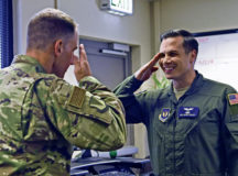 U.S. Air Force Staff Sgt. Wayne Phillips, 76th Airlift Squadron flight attendant, salutes U.S. Air Force Col. Matthew Husemann, 86th Airlift Wing vice commander, at the 76th Airlift Squadron headquarters building on Ramstein Air Base, June 27. Phillips was recognized as the 86th Airlift Wing’s Airlifter of the Week.
