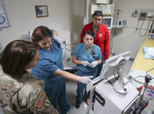(From left) U.S. Army Maj. Julie Duffy,  clinical nurse specialist, Intensive Care Unit, Landstuhl Regional Medical Center, Petra Wine, critical care nurse, U.S. Army 1st Lt. Dalia Galvan Tavera, staff nurse, ICU, and U.S. Army Spc. Miguel Lugo, licensed practical nurse, ICU, discuss the operations of medical equipment used for Continuous Renal Replacement Therapies during CRRT training at LRMC’s ICU, Dec. 19.