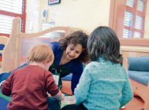 A Smith Child Development Center caregiver interacts with children in a play group in Baumholder, Germany. Smith CDC is one of seven Army CDCs offering child care in the U.S. Army Garrison Rheinland-Pfalz footprint. Photo by Mary Ann Davis