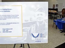 An informational stand sits aside a booth for the Air Force Aid Society’s 75th anniversary on Ramstein Air Base, Mar. 10, 2017. Older than the Air Force itself, the AFAS traces its roots back to 1942. General Henry H. Arnold had a vision of an organization that embodied the idea of Airmen helping Airmen, and it still drives the Air Force’s mission across the world today. Photo by Senior Airman Lane T. Plummer